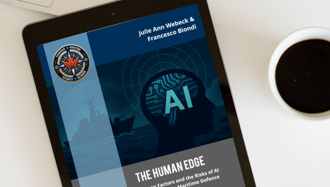 tablet with AI in maritime defense report cover on table with coffee and laptop