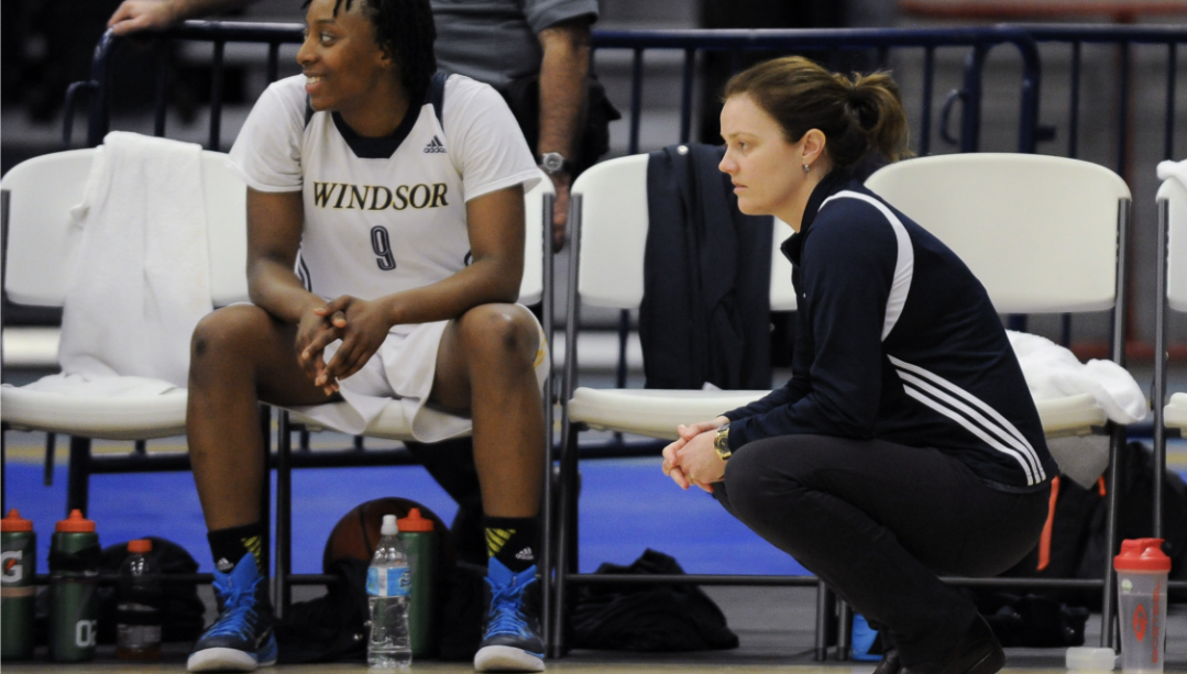 Head coach Chantal Vallée and guard Chidera Ifearulundu (No. 9) watch the action intently during the Windsor Lancers’ game