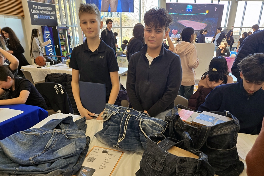 Two elementary students from Legacy Oak Trail Public School at their booth