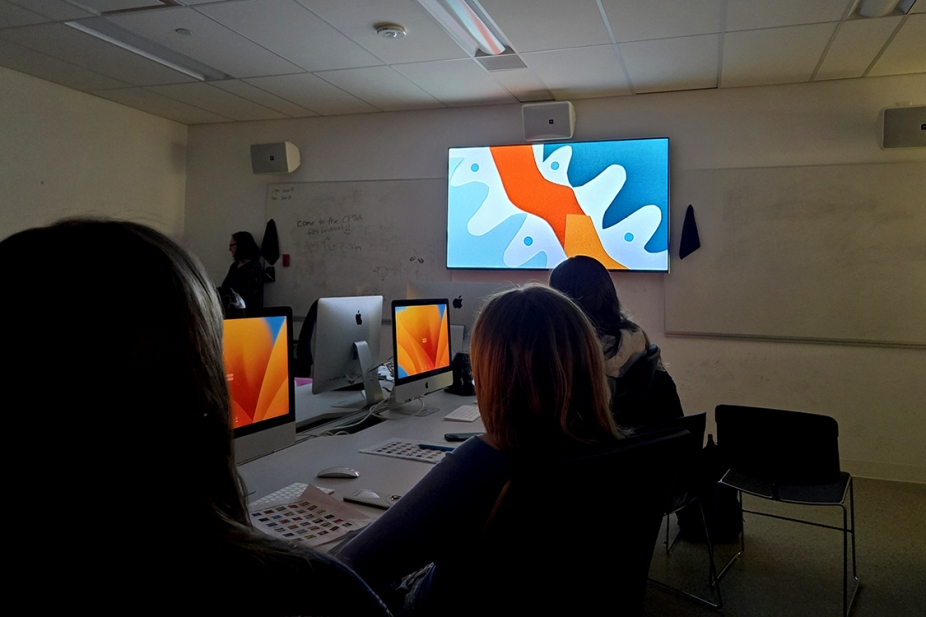 students in a classroom watching stop-motion videos on a screen