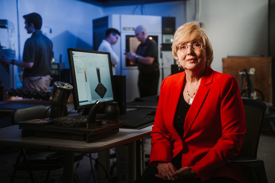 Dr. Jill Urbanic sitting in her lab