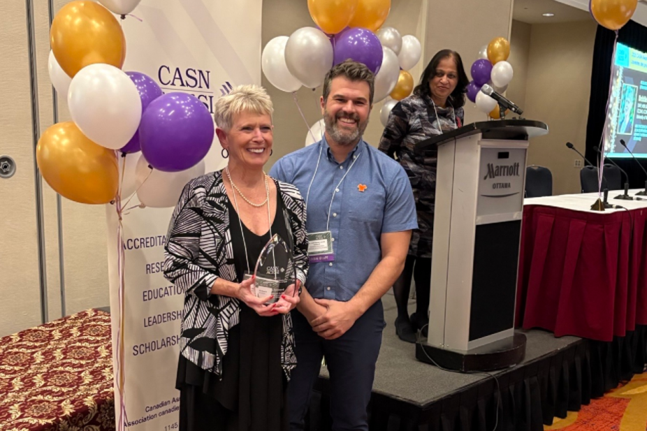 Dr. Rickeard receiving CASN award 