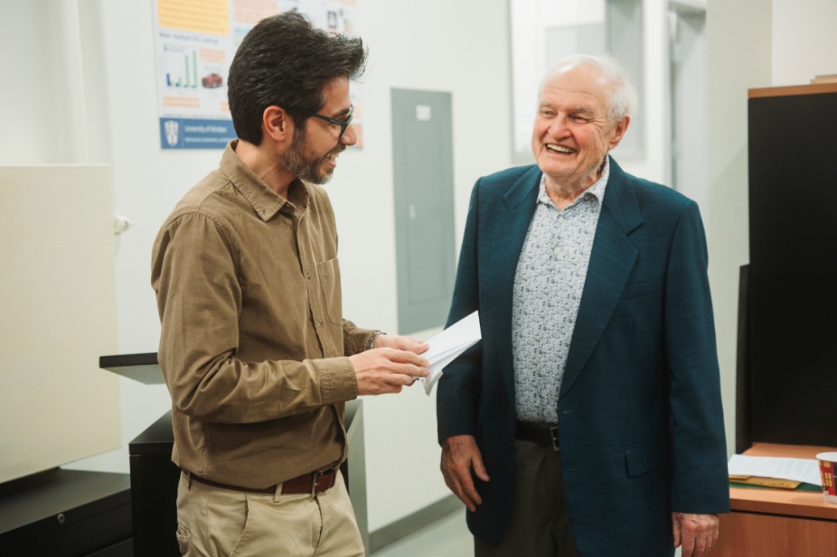 Dr. Dan Watt presenting scholarship in Materials Engineering to recipient, graduate student Amirmasoud Khodadadibehtash