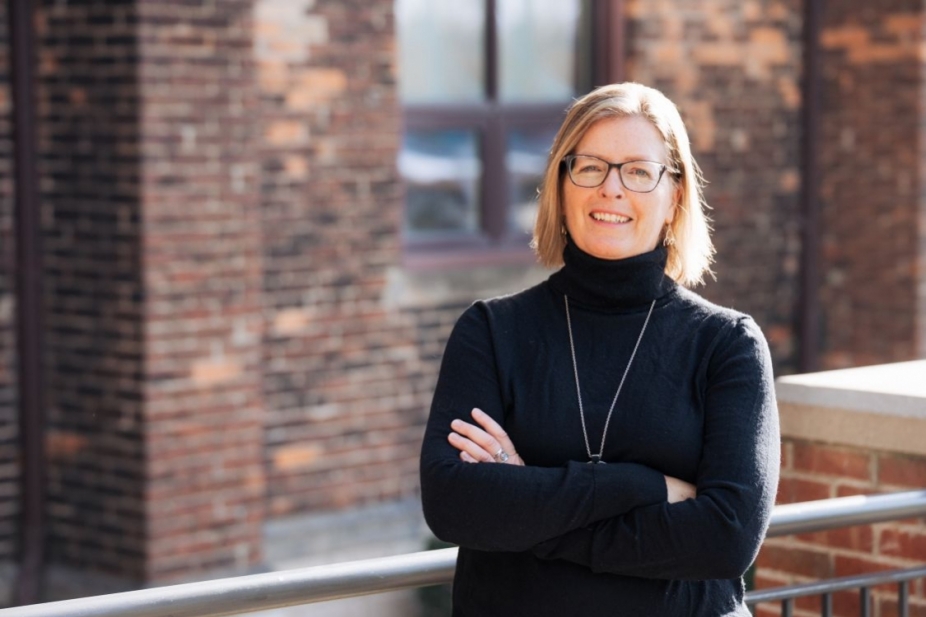Linda Rohr in front of Assumption Hall 