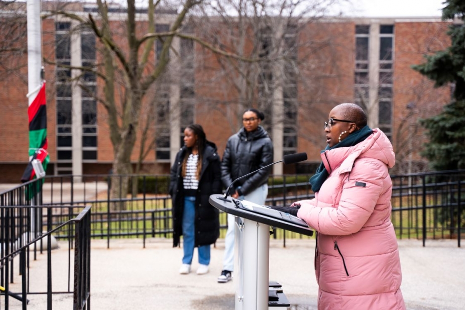 Shetina Jones speaks at the Pan-African flag raising