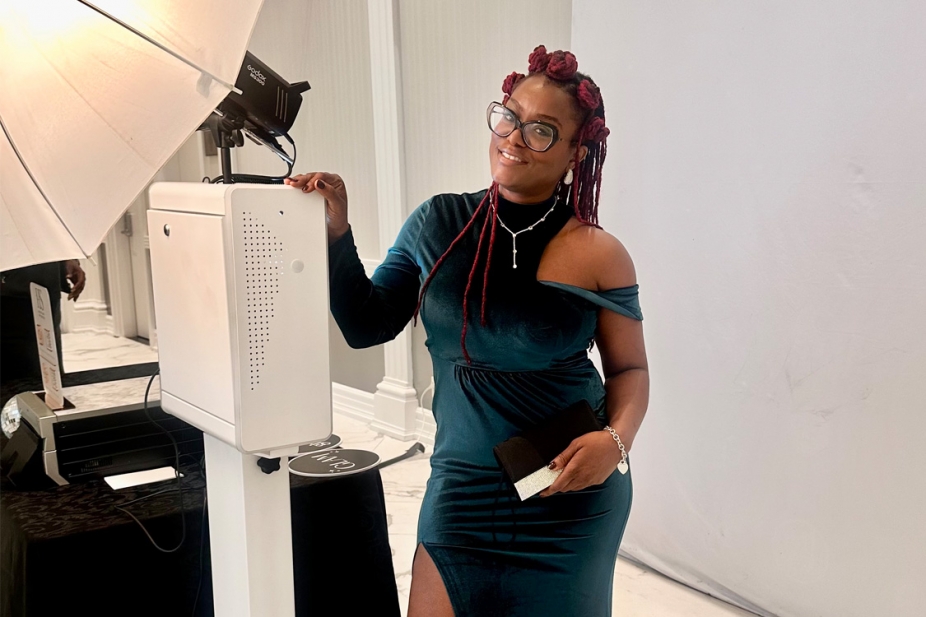 Teisha Gentles poses with her photo booth equipment.