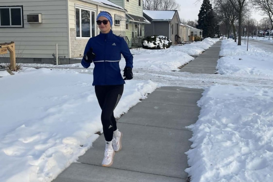 Brittany Bellemore runs in the snow