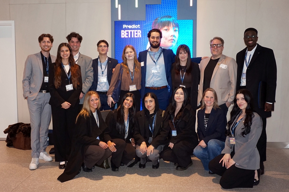 photo of students, faculty and industry partners at one of the company buildings