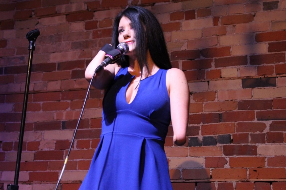 Courtney Gilmour performs stand up comedy 