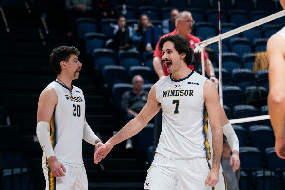 Anthony Ivanovski celebrates a point on volleyball court.