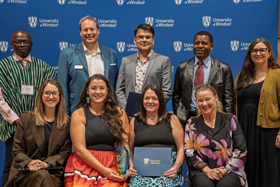 President J.J. McMurtry stands with Equity, Diversity and Inclusion Awards recipients.