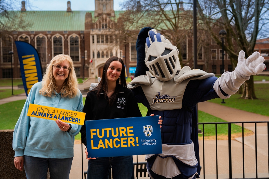 A future lancer celebrates with a family member and Winston.