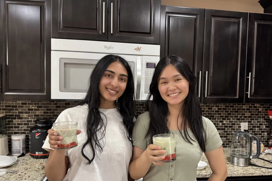Sona Regonda &amp; Linda Nguyen, co-leads on The Cozy Kitchen Cookbook pose with a refreshing iced strawberry lemon matcha latte. 