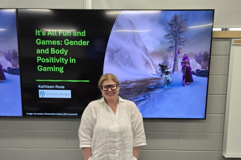 Kathleen Rose in front of her thesis defense presentation