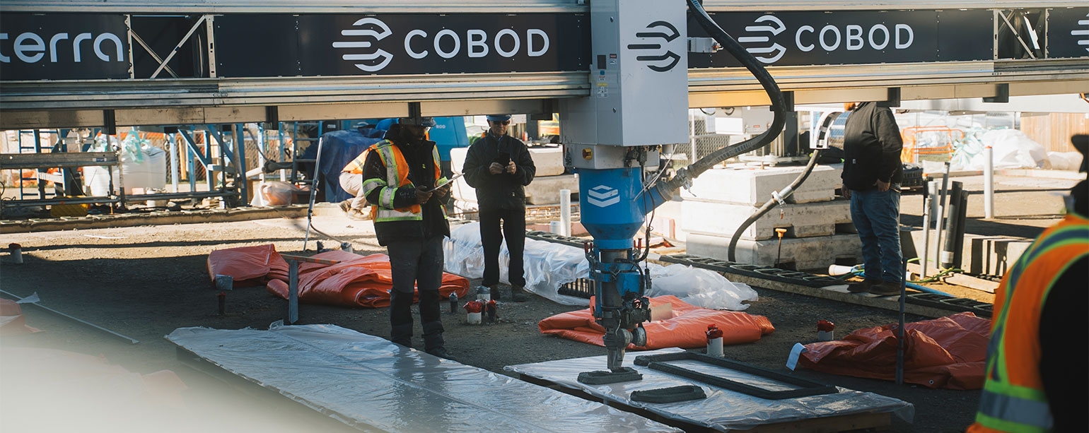 Workers operate a large-scale 3D printer on site at 1025 California Ave. as the University of Windsor begins construction on Canada’s first net-zero, multi-storey 3D-printed student residence — a milestone made possible through support from FedDev Ontario
