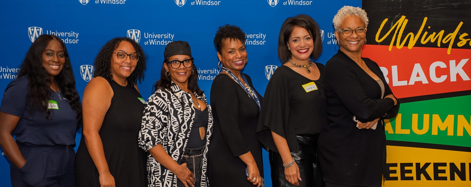 Six women of colour pose for a group photo