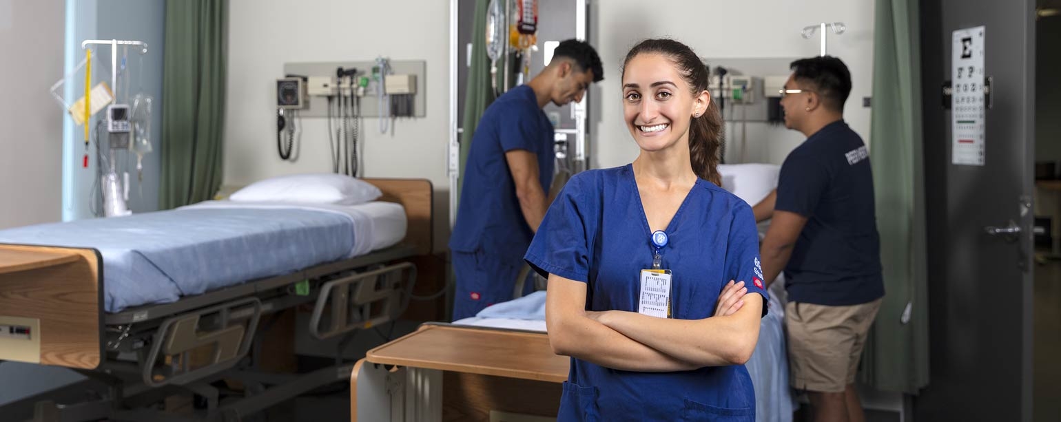 Smiling student in simulation lab