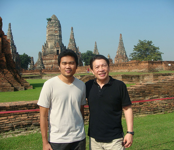 Dr. Ben C. H. Kuo and student standing in front of historical Thailand buildings