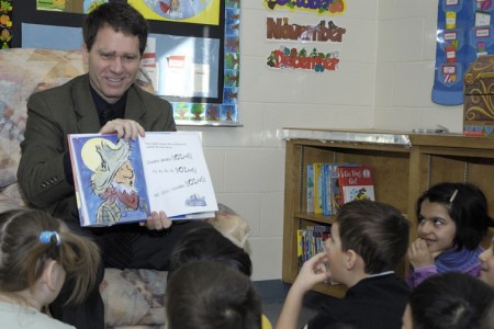 Dr. Smith reading to children