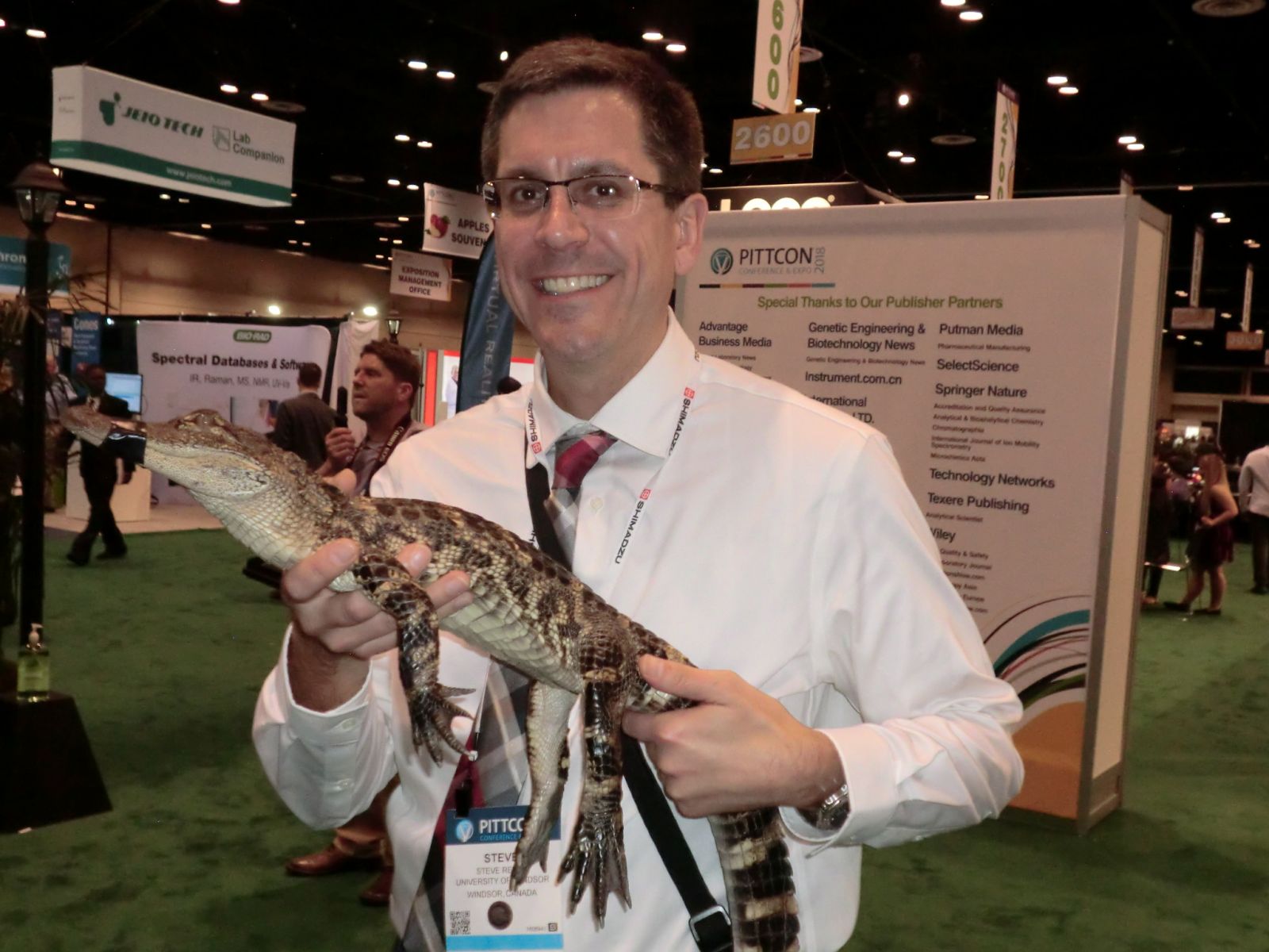 Dr Rehse holding a small alligator