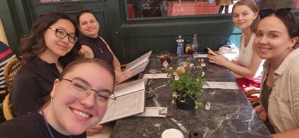 Students smiling at the dinner table