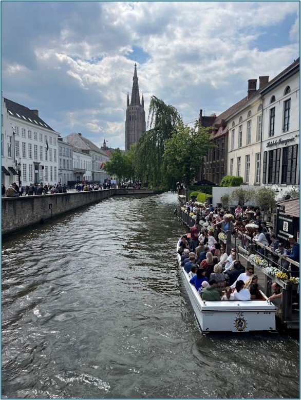 Group of students in a boat in canal