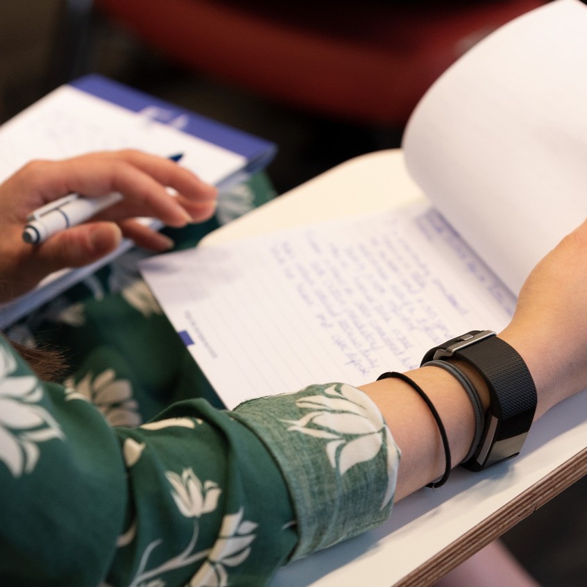 Hands flipping through a document