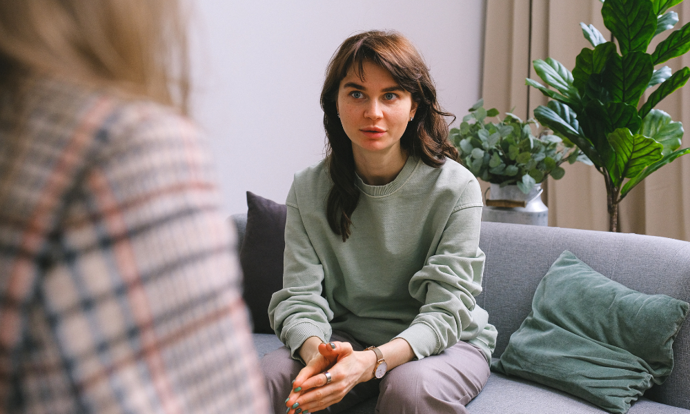 Student talking to staff member 