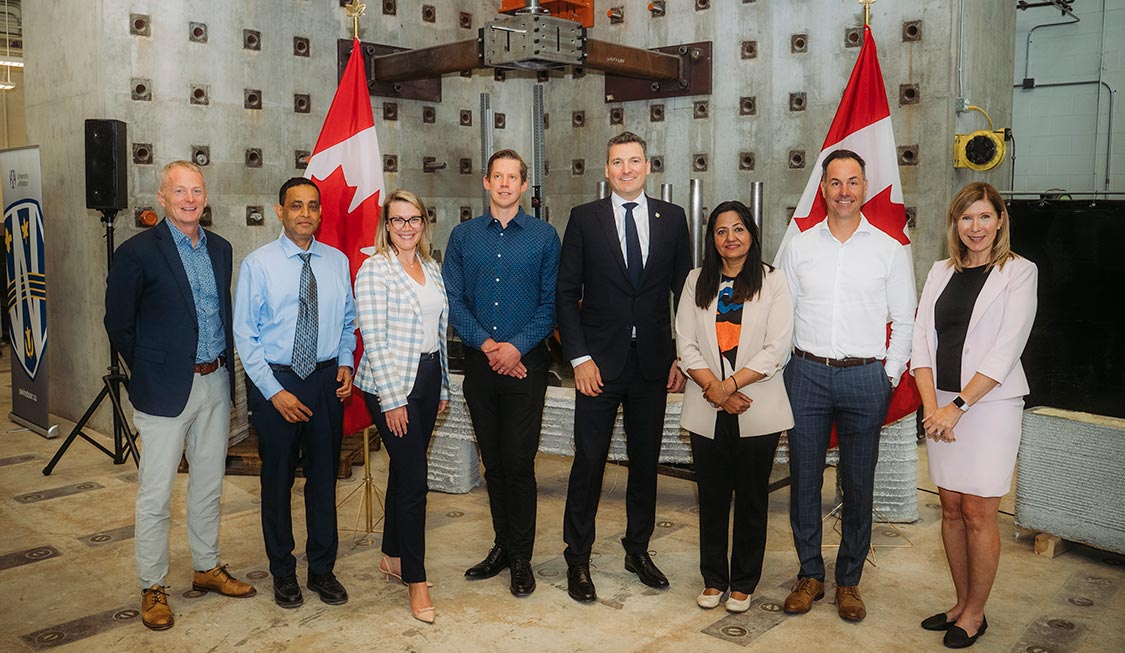 University and government leaders with industry partners at a Windsor Engineering event celebrating innovation and collaboration