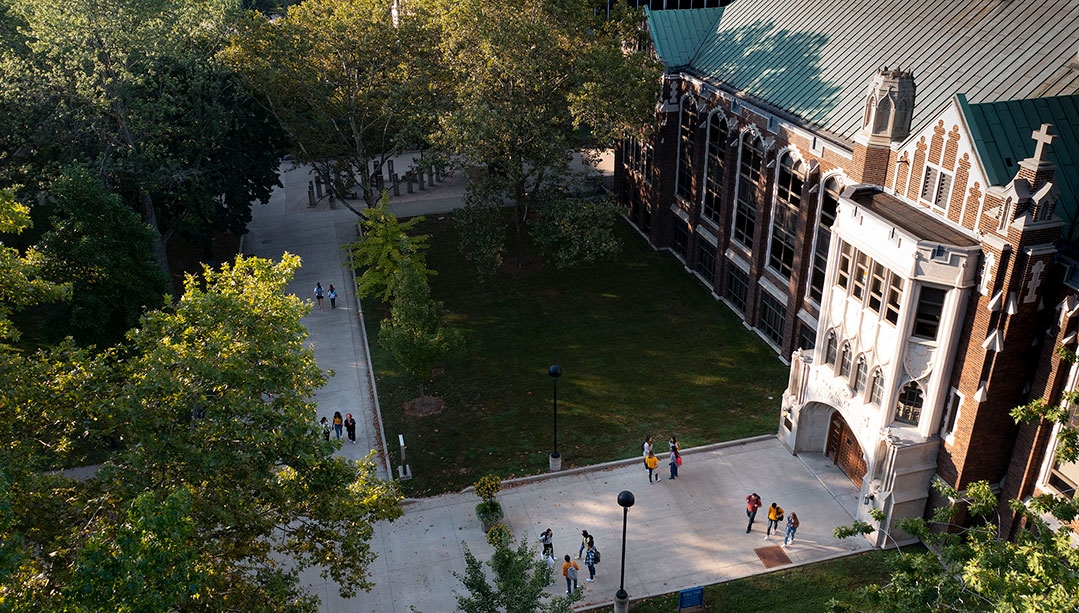 Students hang out in front of the University of Windsor's Dillon Hall