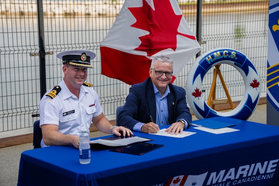 Elliott and Gordon sign document