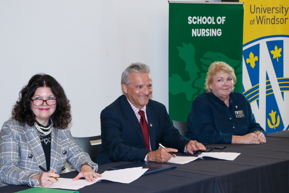 St. Clair College President Patti France, University of Windsor President Robert Gordon and University of Windsor Faculty of Nursing Dean Debbie Sheppard-LeMoine sign a memorandum of understanding at the Chatham-Kent Health Alliance on Thursday, Oct. 5, 2