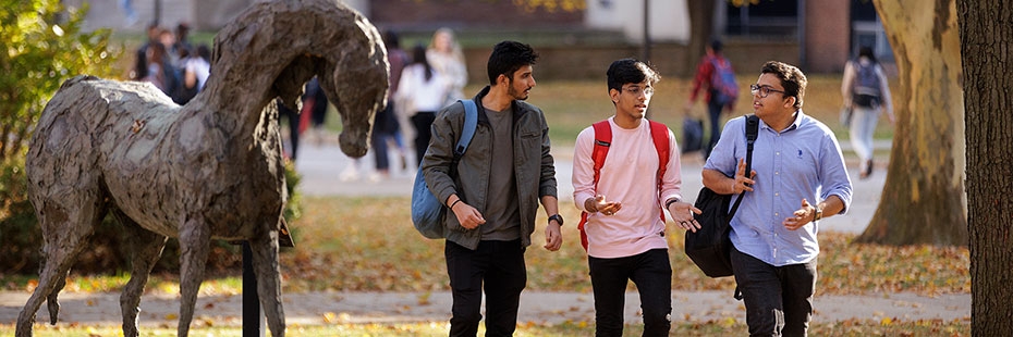 Students walk through the University of Windsor campus.