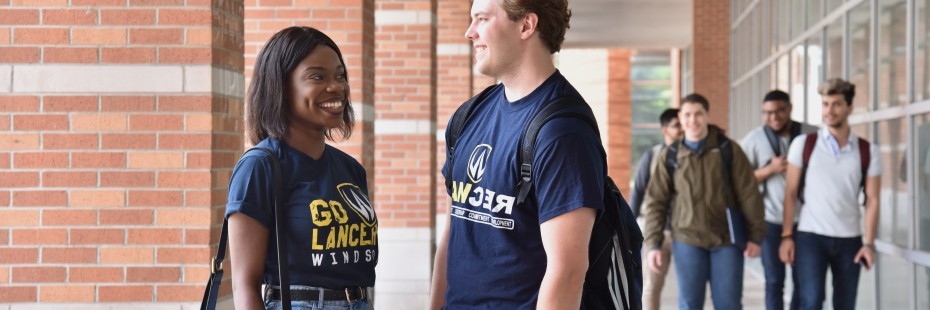 Students talking outside the CAW