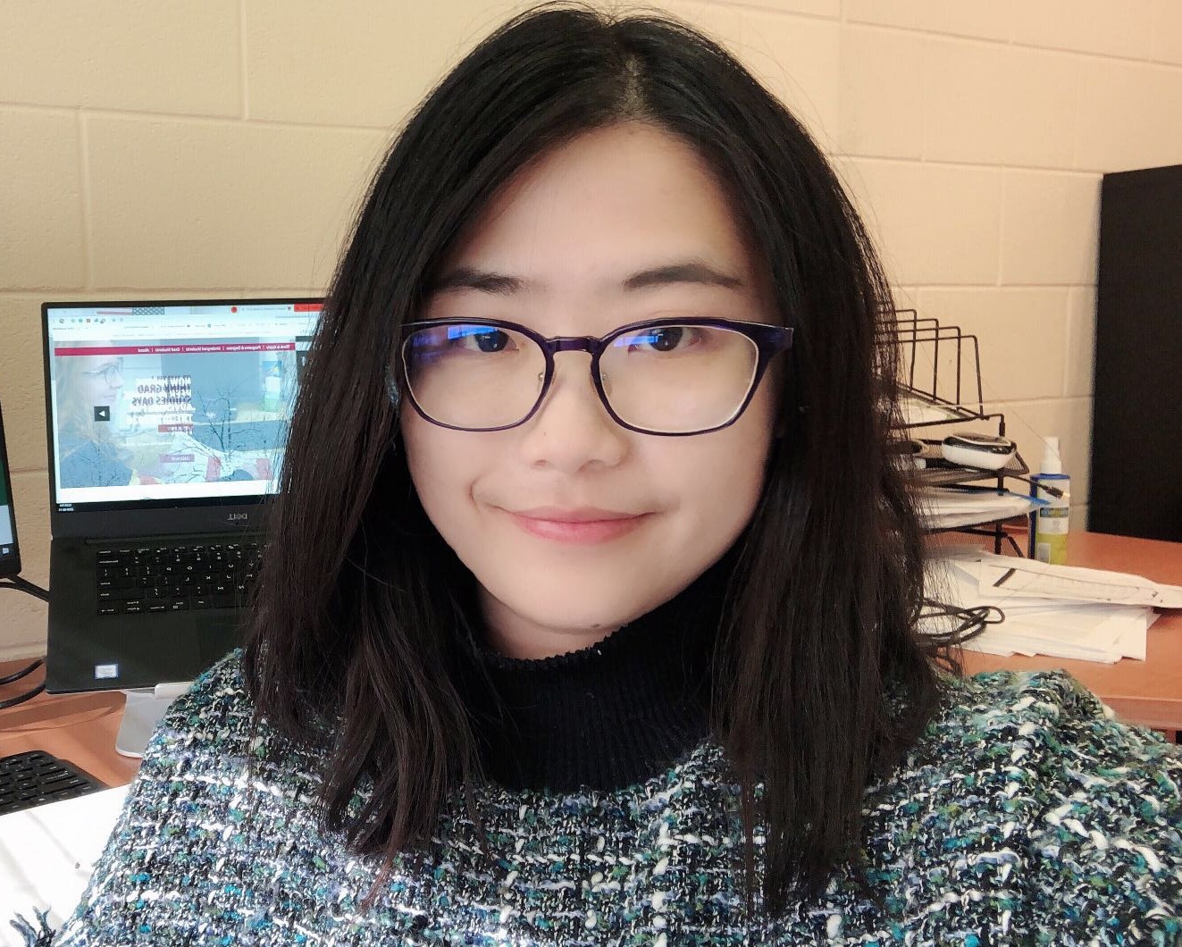 Photo of Dr. Yuan Tian smiling.