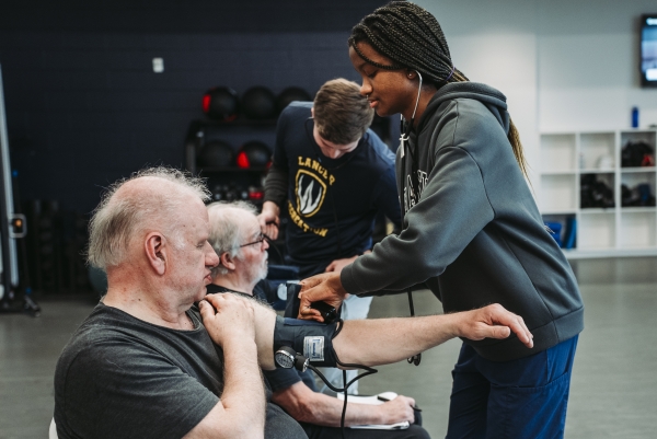 Cardiac Wellness Program participants have their vitals checked by UWindsor students at the Toldo Lancer Centre. 