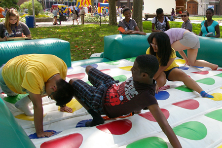 laughing students play Twister