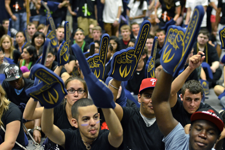 students waving Lancer foam fingers