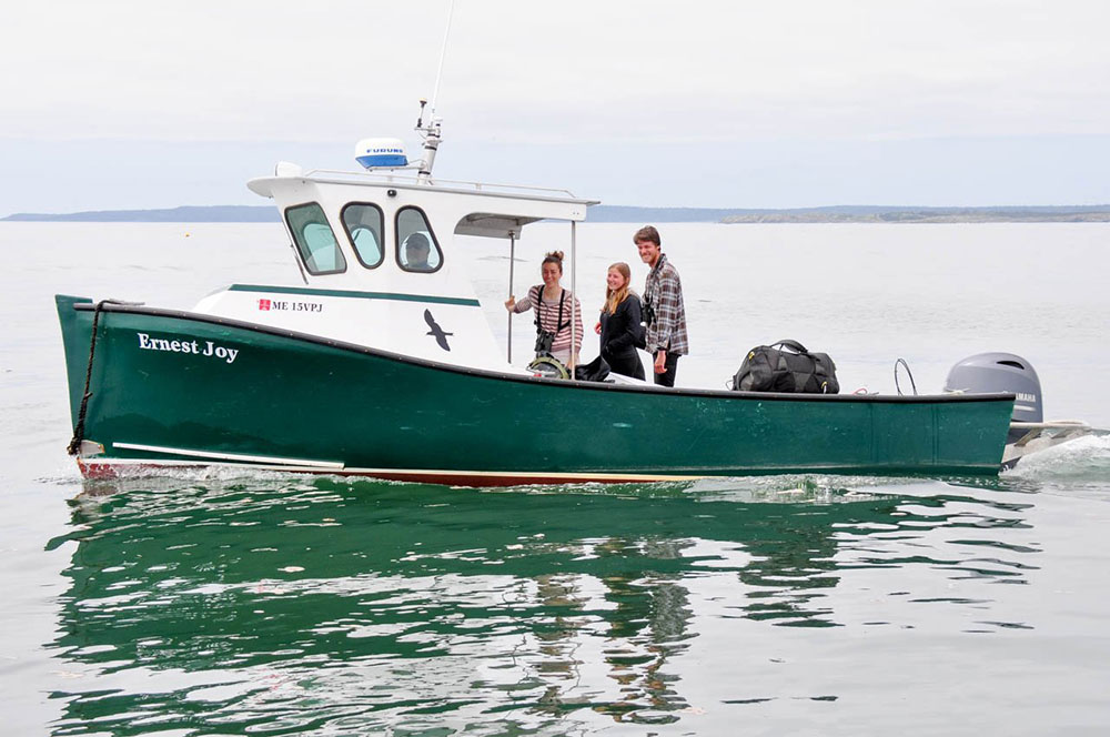 Katherine McGuire, Ines Moran, and Ian Thomas on the research boat the "Ernest Joy." (Photo courtesy of Stéphanie Doucet)