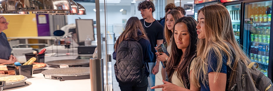 Students at a food counter in cafeteria