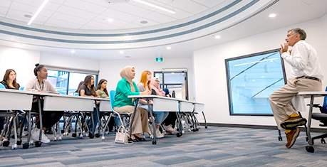 Low angle of classroom photo of instructor and students