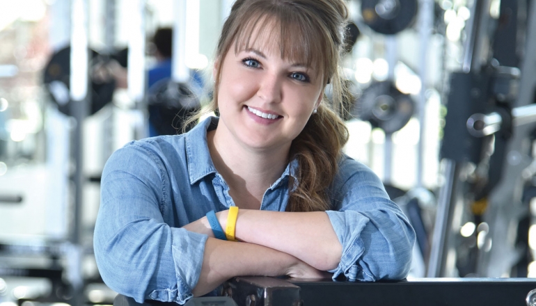 HK student Kelly Carr is shown in the University of Windsor weight room.