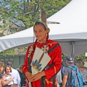 A girl in ceremonial dress is shown as part of the Turtle Island Walk day of celebration. 