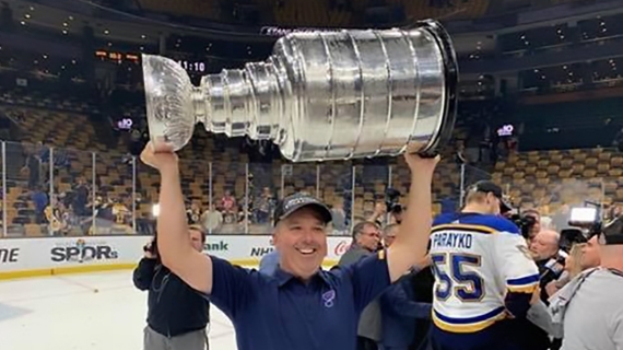 UWindsor grad Michael Murphy, chiropractor for the St. Louis Blues, hoists the Stanley Cup after the team won its first-ever NHL title.