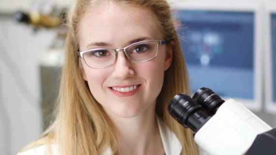 Melanie Grondin is shown in the lab of Dr. Lisa Porter, where she has helped conduct cancer research.